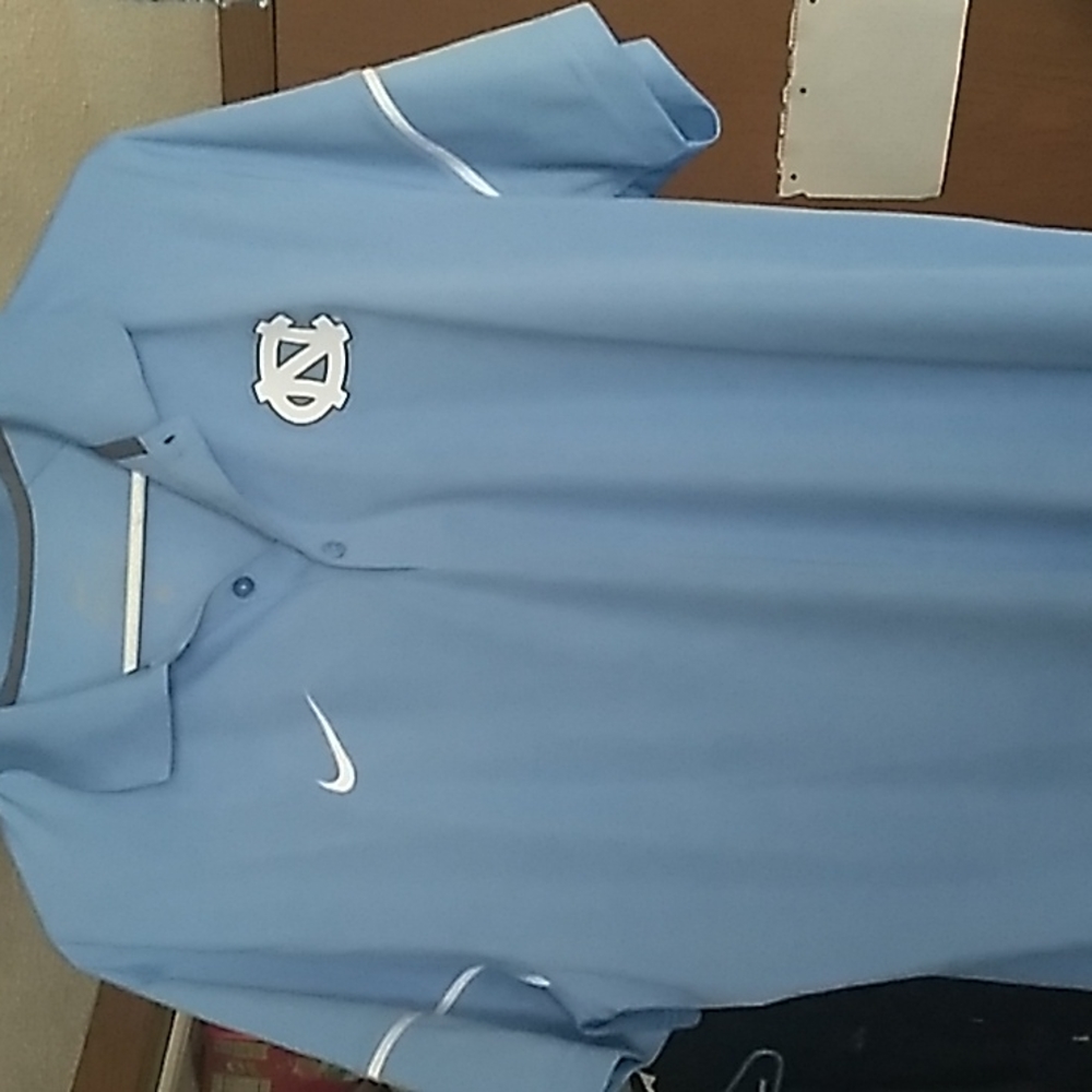 Nike dri-fit North Carolina shirt. Baby Blue with 3 buttons at the collar. Lrg